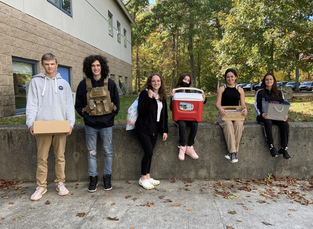 EWG students pose with their "backpack alternatives"